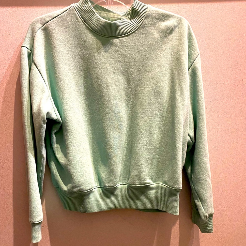 A new day fleece pullover in mint green